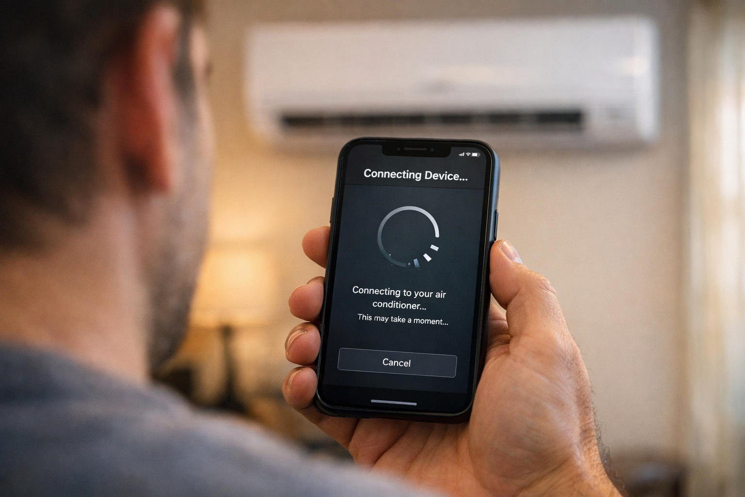 Person connecting GE AC to WiFi using smartphone app