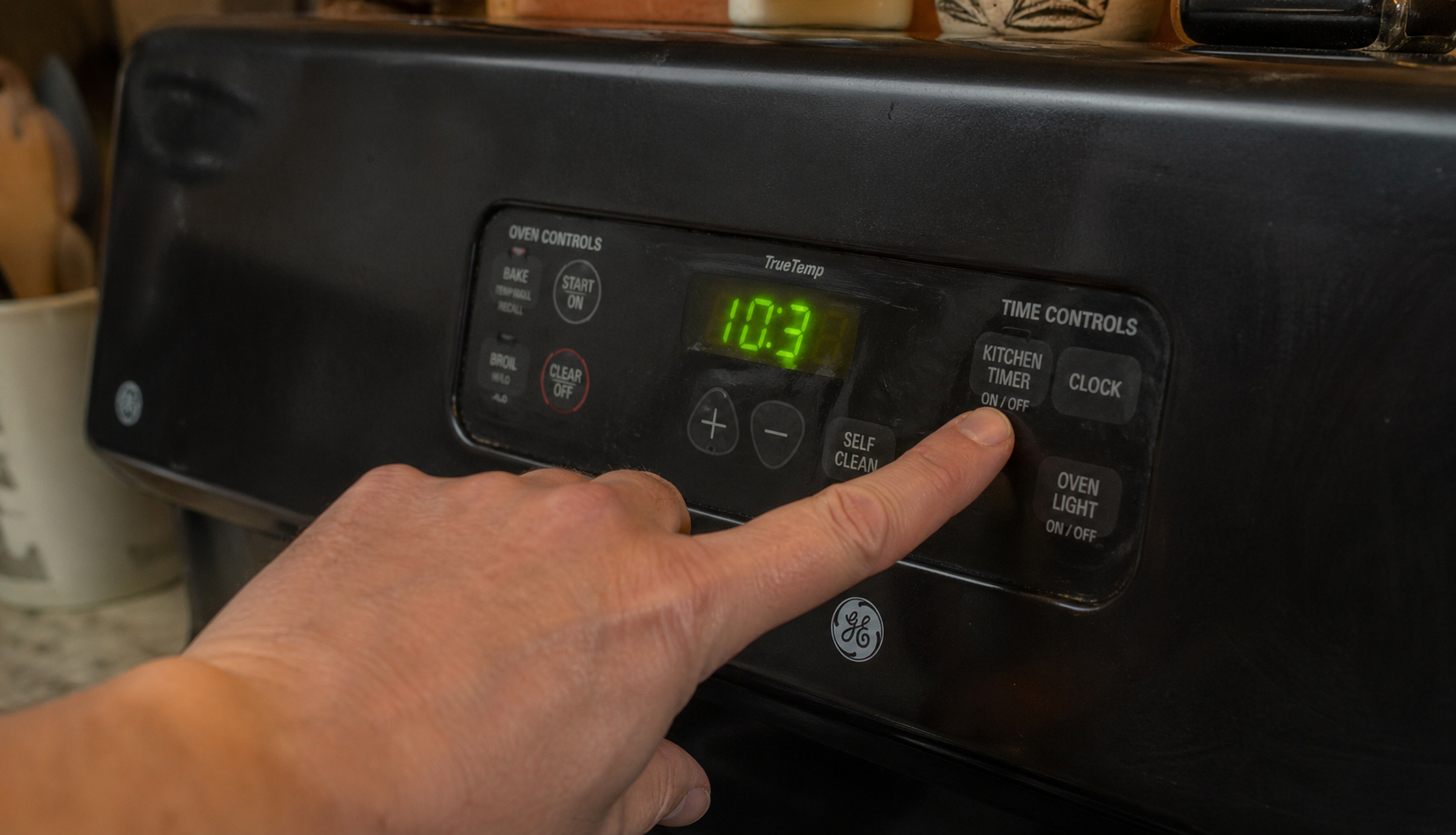 hand adjusting time on GE oven control panel