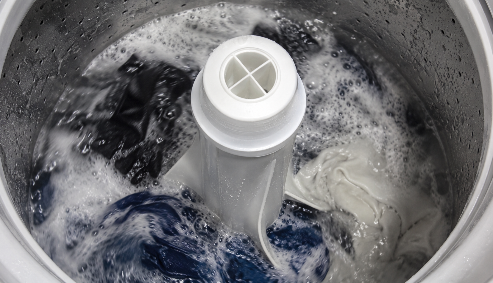ChatGPT Image May 31, 2026, 11_45_40 PM Agitator post rotating inside washing machine drum with soapy water and clothes