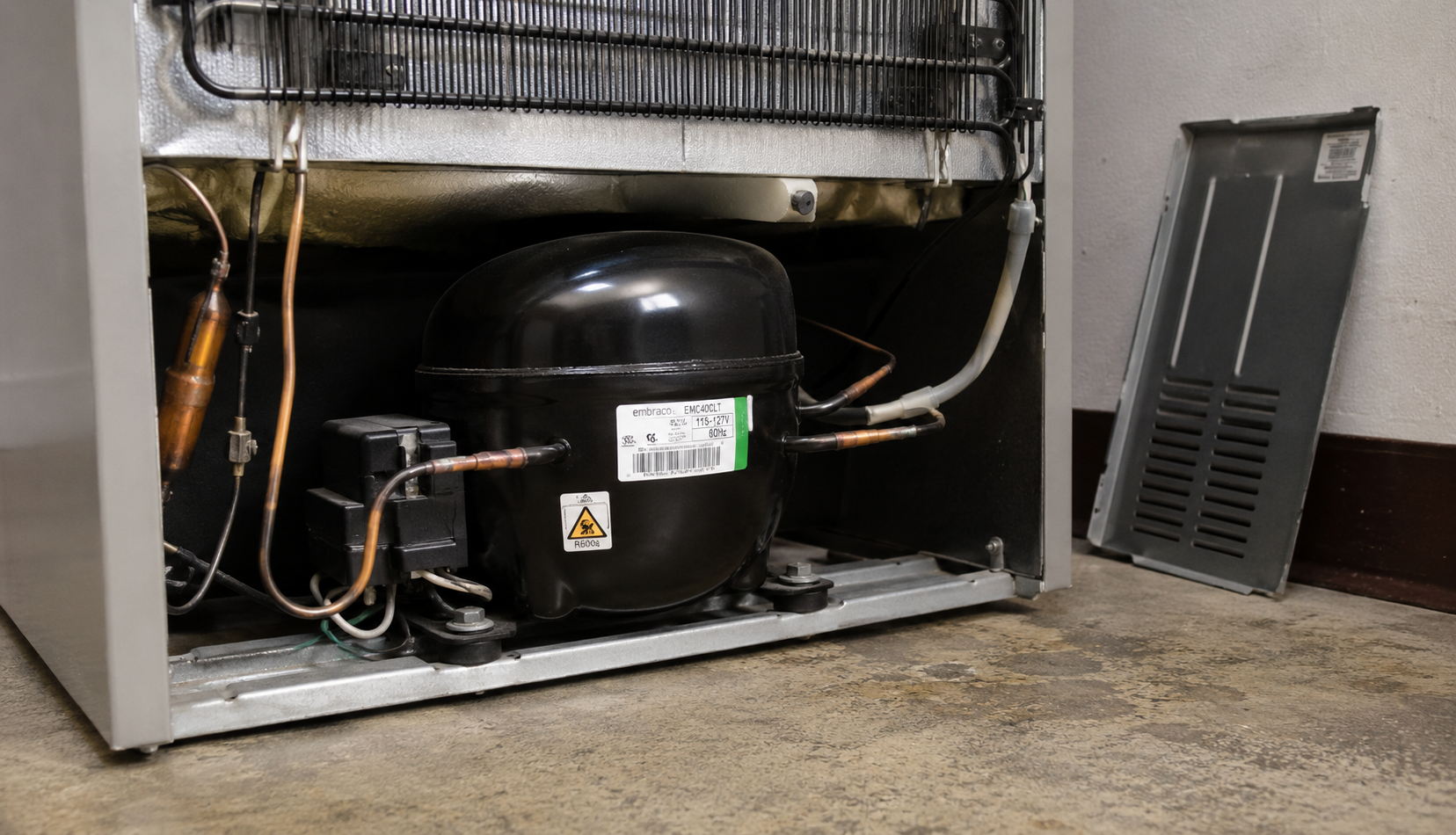 ChatGPT Image Jun 18, 2026, 08_50_13 PM refrigerator compressor visible at back bottom of appliance
