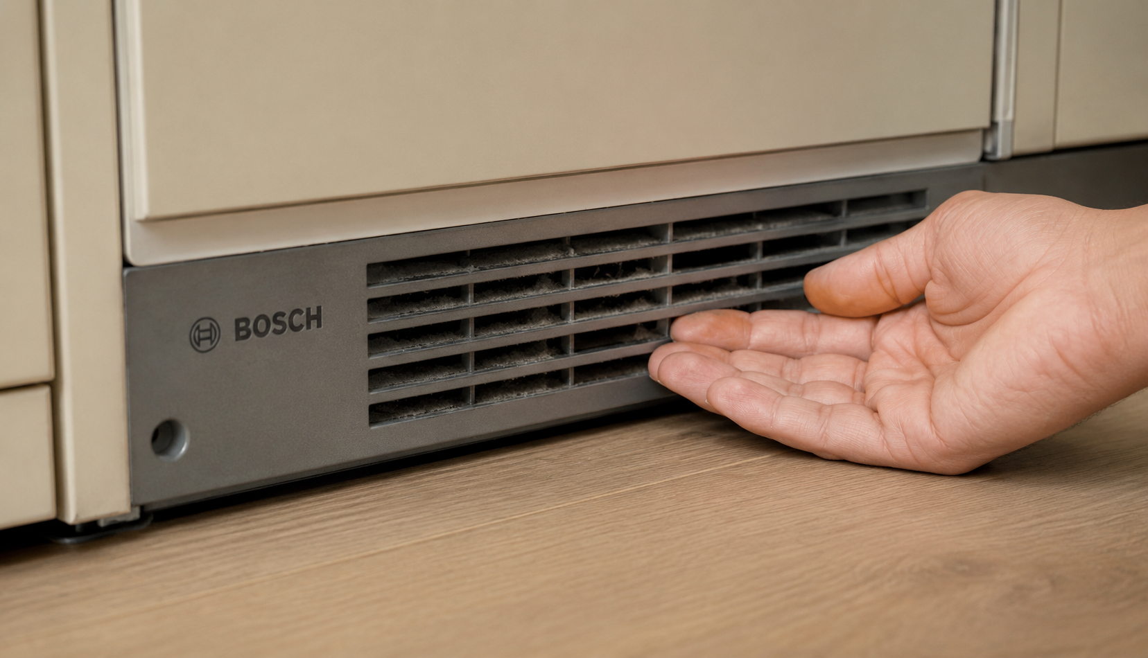 ChatGPT Image Jun 22, 2026, 04_42_44 PM inspecting ventilation grille on built-in Bosch refrigerator