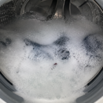 sudsy cloudy water inside washing machine stuck on rinse