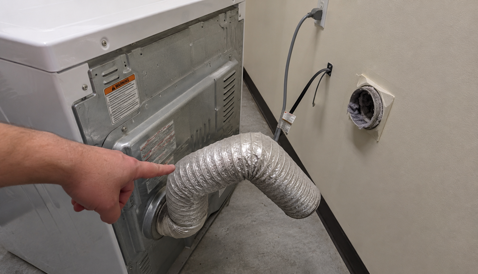 ChatGPT Image Jun 6, 2026, 01_48_18 AM Kinked flexible dryer duct disconnected from wall vent showing airflow blockage