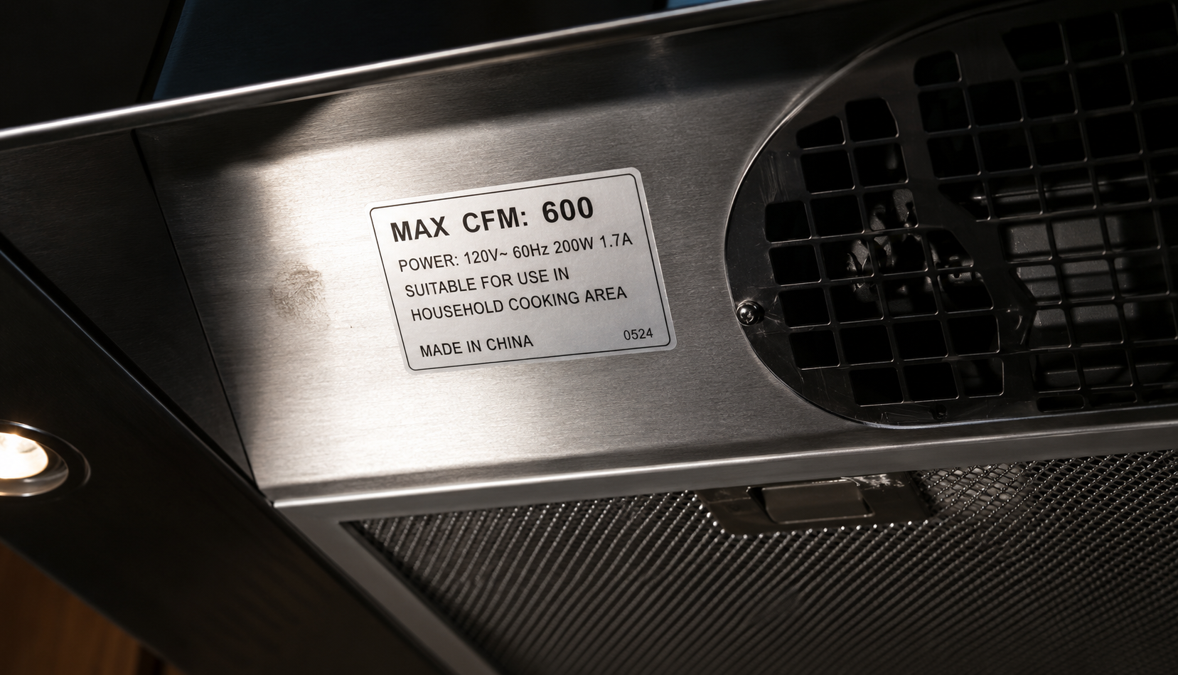 ChatGPT Image Jul 17, 2026, 10_29_36 PM close-up of range hood CFM rating and blower vent
