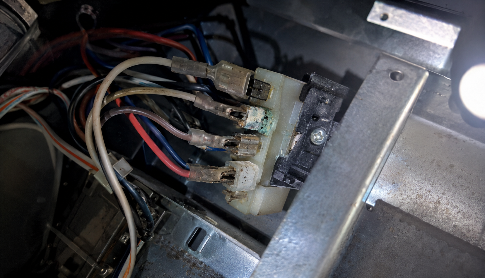 ChatGPT Image Jul 26, 2026, 10_29_37 PM Corroded wiring connector behind Whirlpool gas range control panel