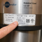 Checking garbage disposal installation date on unit nameplate label