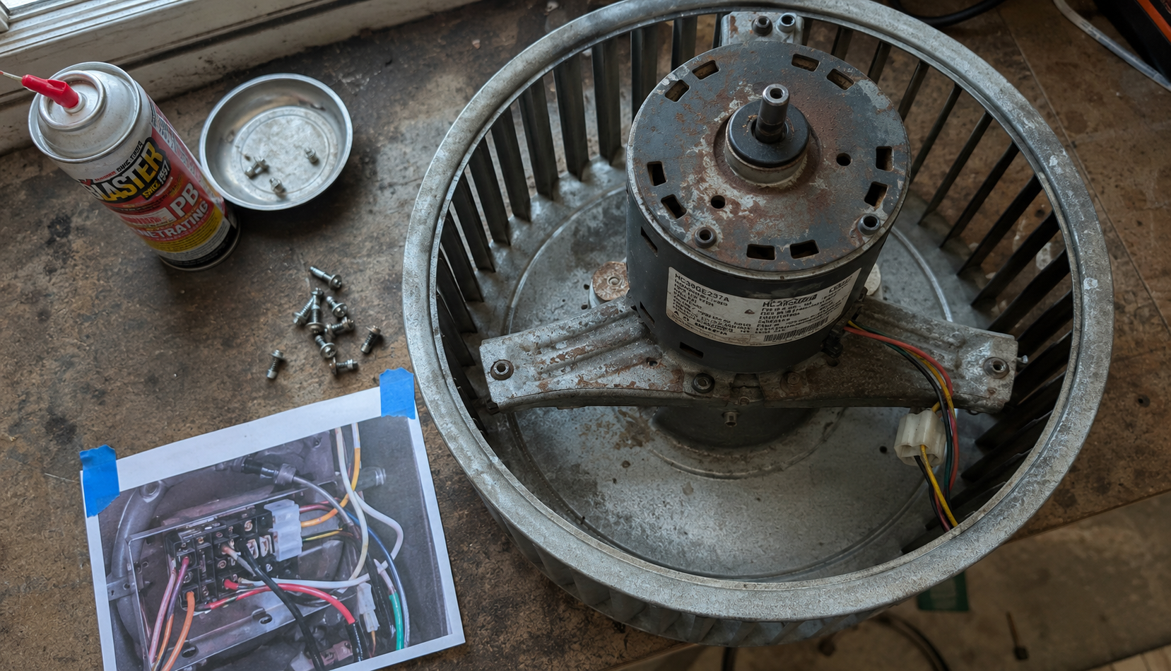 ChatGPT Image Aug 21, 2026, 03_27_56 AM Removed furnace blower motor and wheel assembly on workbench