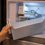 Checking Frigidaire ice maker bail arm inside freezer