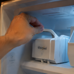 Checking Whirlpool ice maker feeler arm inside freezer