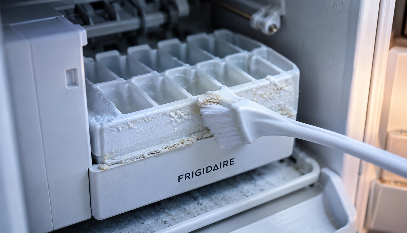 ChatGPT Image Aug 6, 2026, 08_26_38 PM Cleaning mineral buildup from Frigidaire ice maker mold