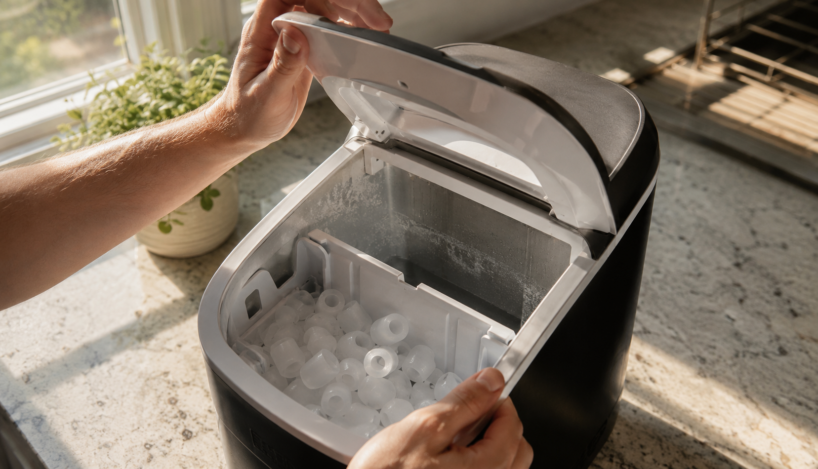 ChatGPT Image Aug 8, 2026, 07_47_37 PM Opening a countertop ice maker to check for buildup
