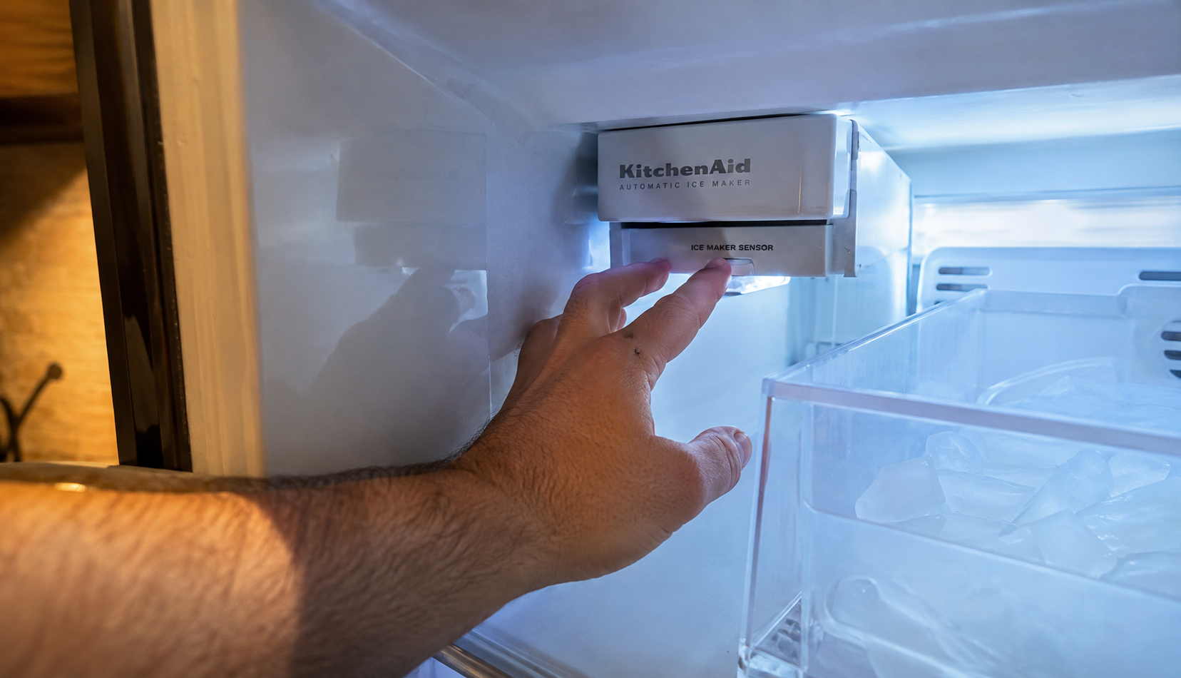 ChatGPT Image Aug 9, 2026, 06_09_53 PM Checking KitchenAid ice maker sensor inside freezer